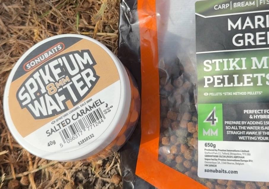 Sonubaits 8mm Salted Caramel Spike’um Wafters beside a bag of 4mm Marine Green Stiki Method Pellets