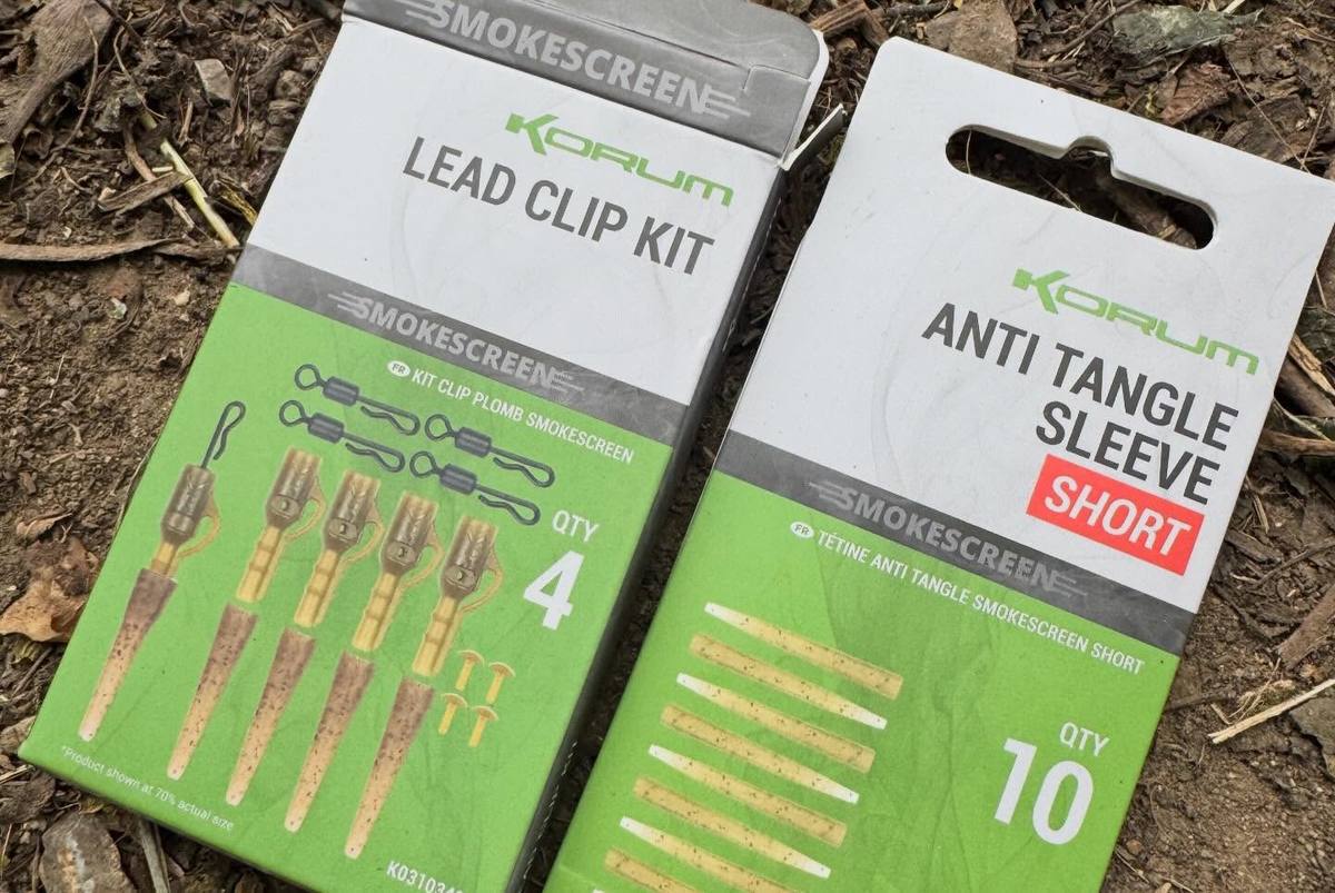 Korum Smokescreen Lead Clip Kit and short Anti Tangle Sleeve packets on the ground